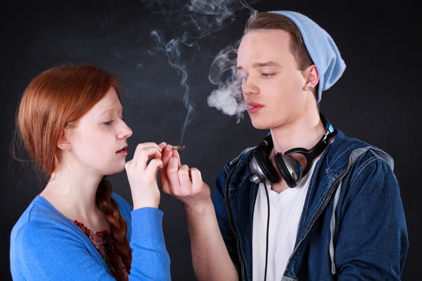 Teenagers smoking marijuana joint