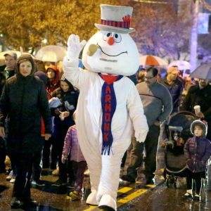 What To Do Thanksgiving Weekend 2019 Ten foot tall Frosty walks with crowd on Main Street in Armonk
