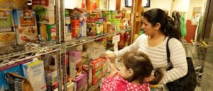 Best Fall Benefits Mohjer and child shopping at the Community Center of Westchester Thrift Shop